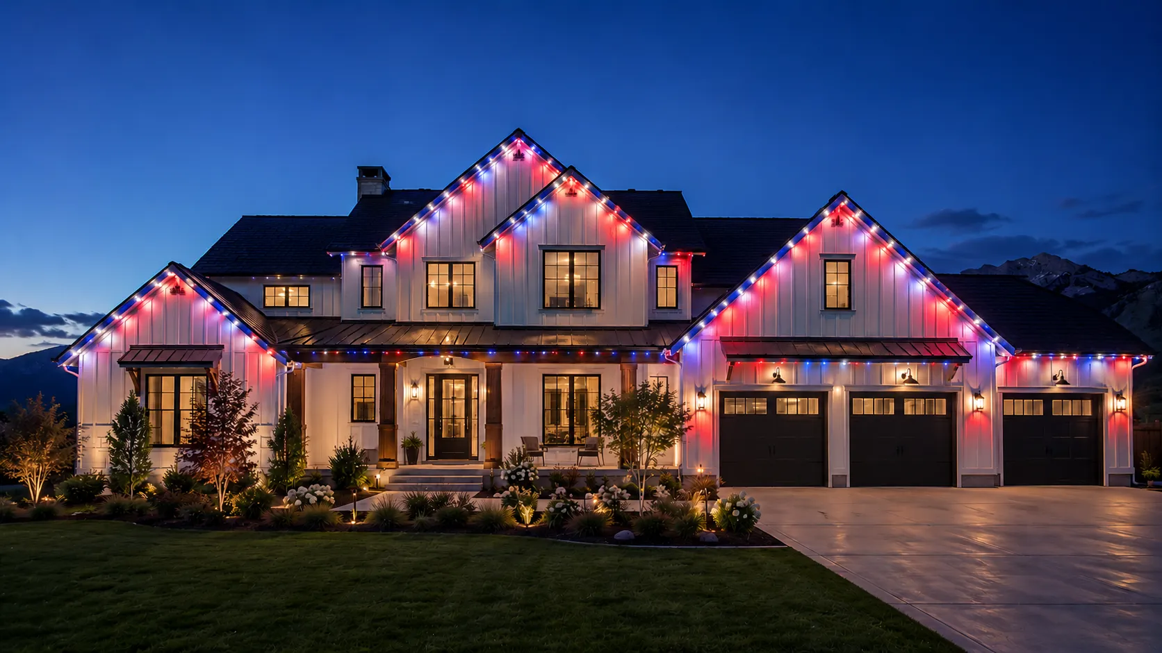 Same Cache Valley home with permanent roofline lighting set to a 4th of July red, white, and blue scene